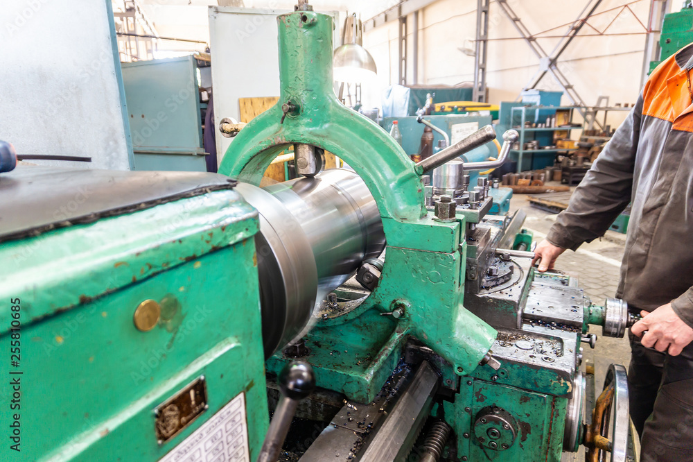 Turner worker manages the metalworking process of mechanical cutting on a lathe. Turner worker manages the metalworking process of mechanical cutting on a lathe.
