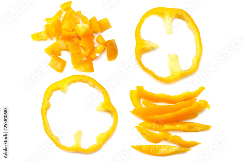 Quadro em tela cut slices of yellow sweet bell pepper isolated on white background top view