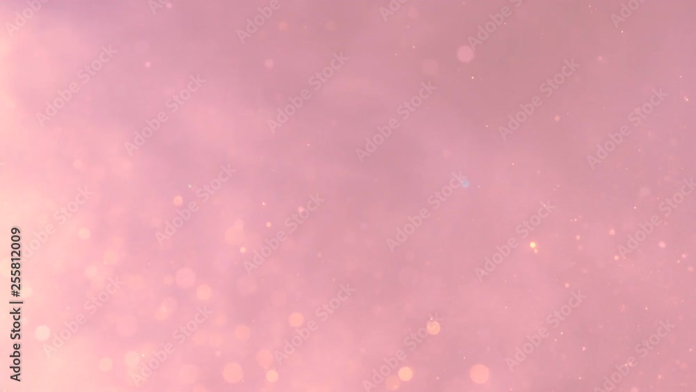 Abstract pink background with moving particles and bokeh. Motion and blinking effect. Abstract particles glitter. Abstract pink background with moving particles and bokeh. Motion and blinking effect. Abstract particles glitter.