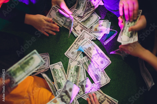 paper money in female hands on green background. photo