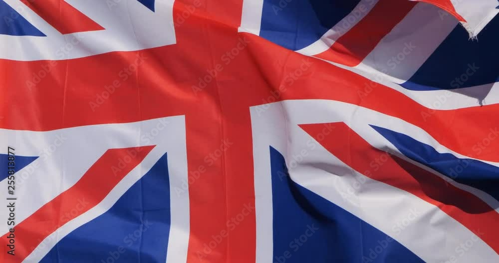The national British flag waving in the wind. The national British flag waving in the wind.