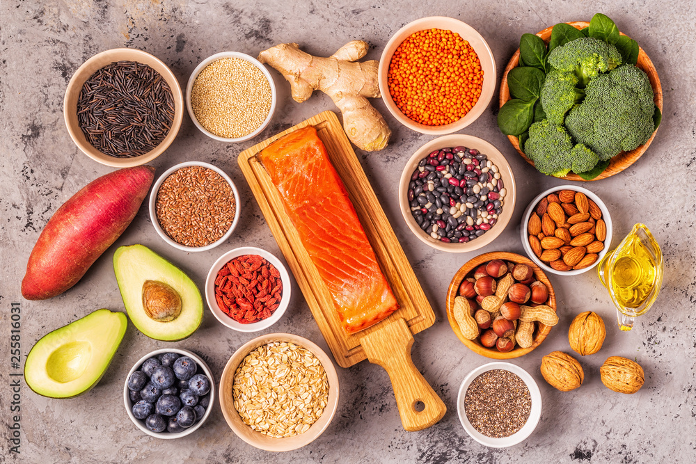 Superfoods on gray concrete background. Top view. Superfoods on gray concrete background. Top view.