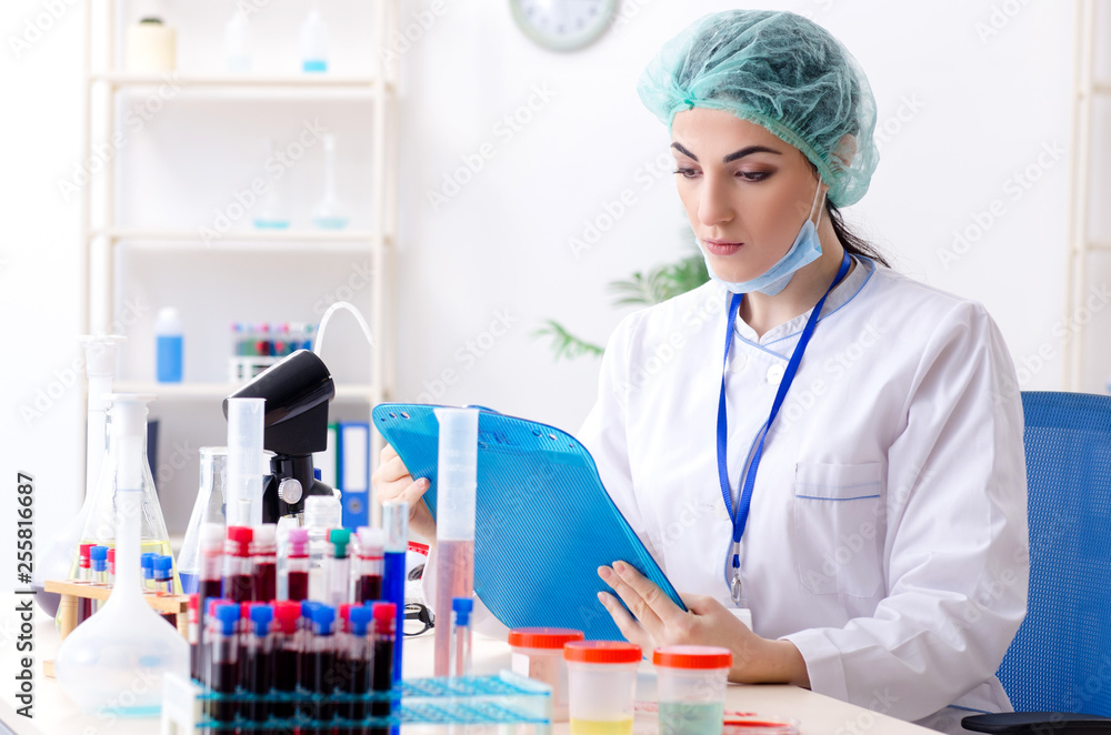 Young female chemist working in the lab Young female chemist working in the lab