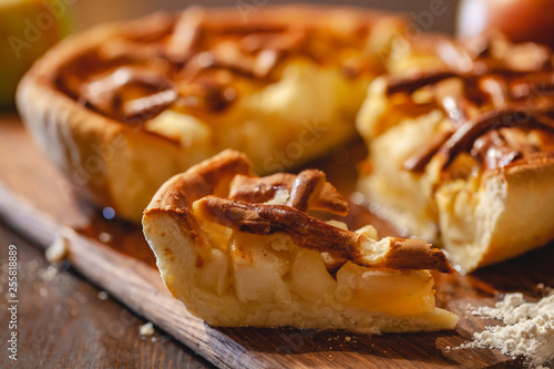 American cuisine. Homemade apple pie on wooden background. Classic autumn Thanksgiving dessert. Close up