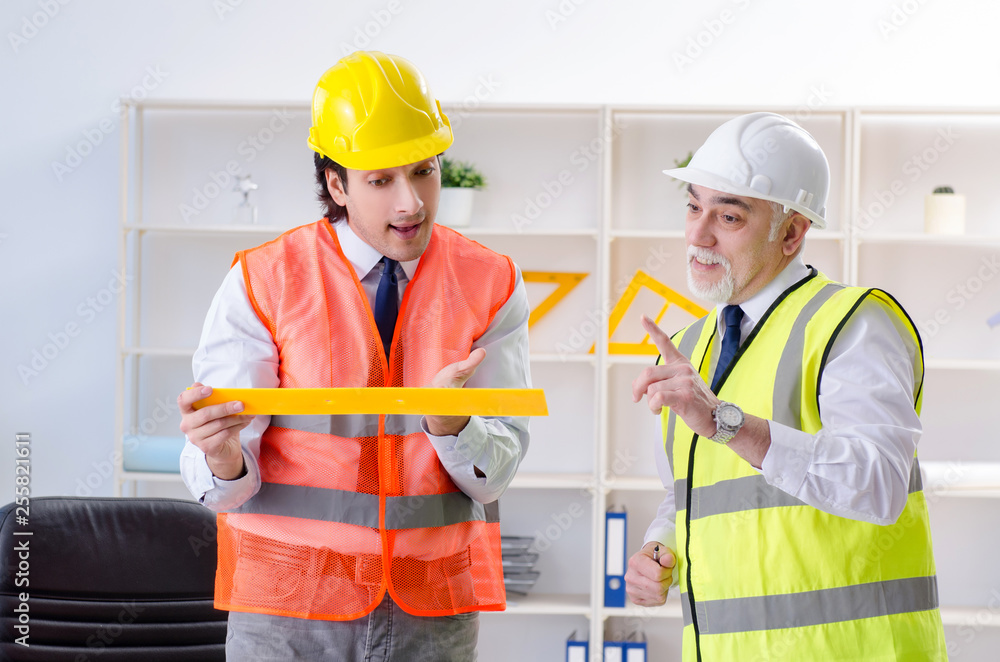 Two engineers colleagues working under project Two engineers colleagues working under project