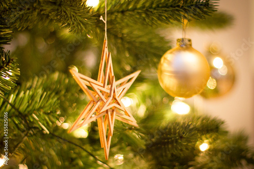 Wooden star on christmas tree