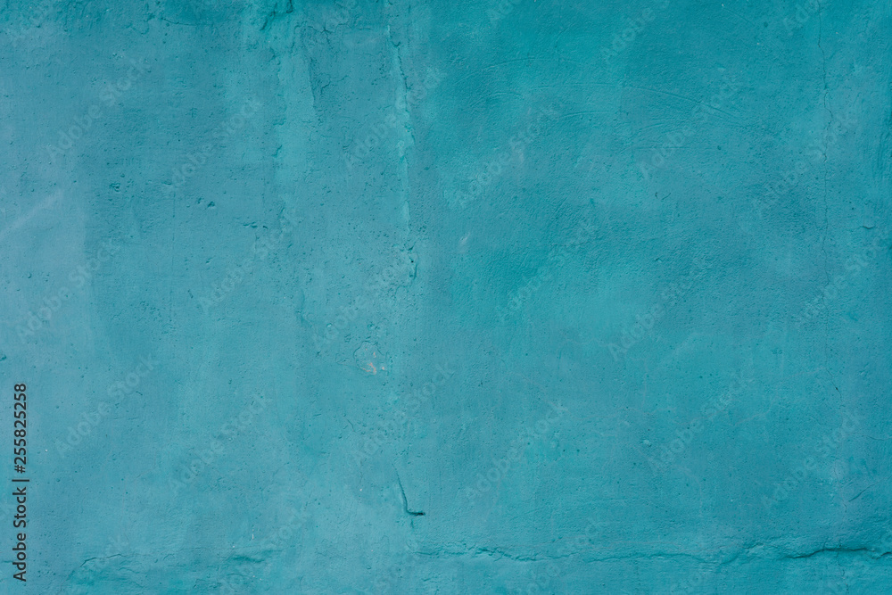 Background of old cracked plaster painted in blue