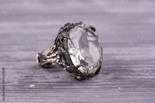 A silver ring with a cut stone from rhinestone