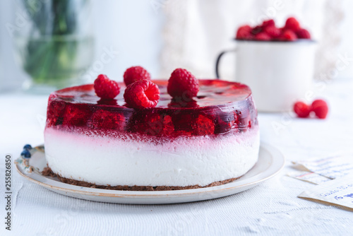 Delicious no bake cheesecake on white background