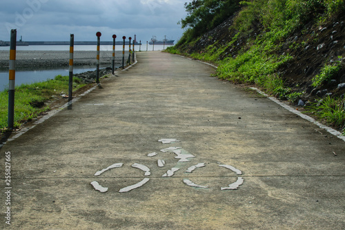 Biking Trail With White Biker Symbol on The Trail photo