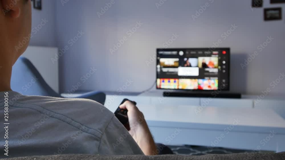 Person watching tv at home. Person watching tv at home.