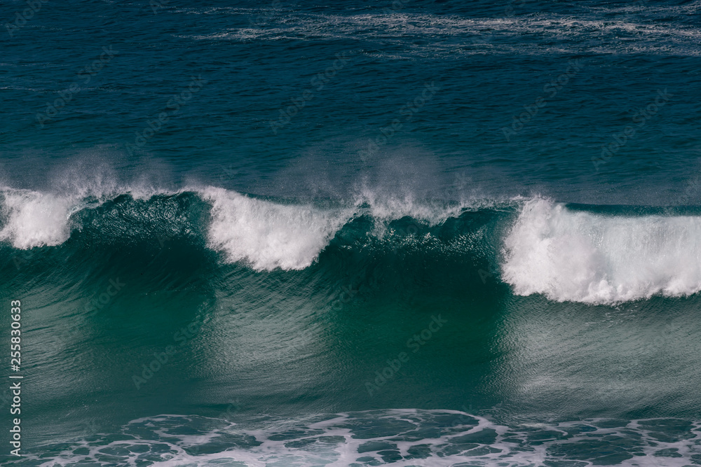 waves breaking in closeup view