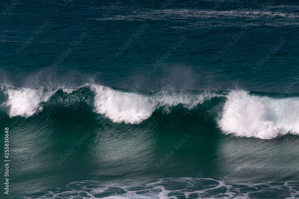 waves breaking in closeup view