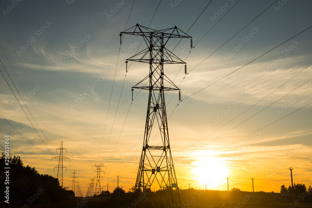 electricity pylons at sunset