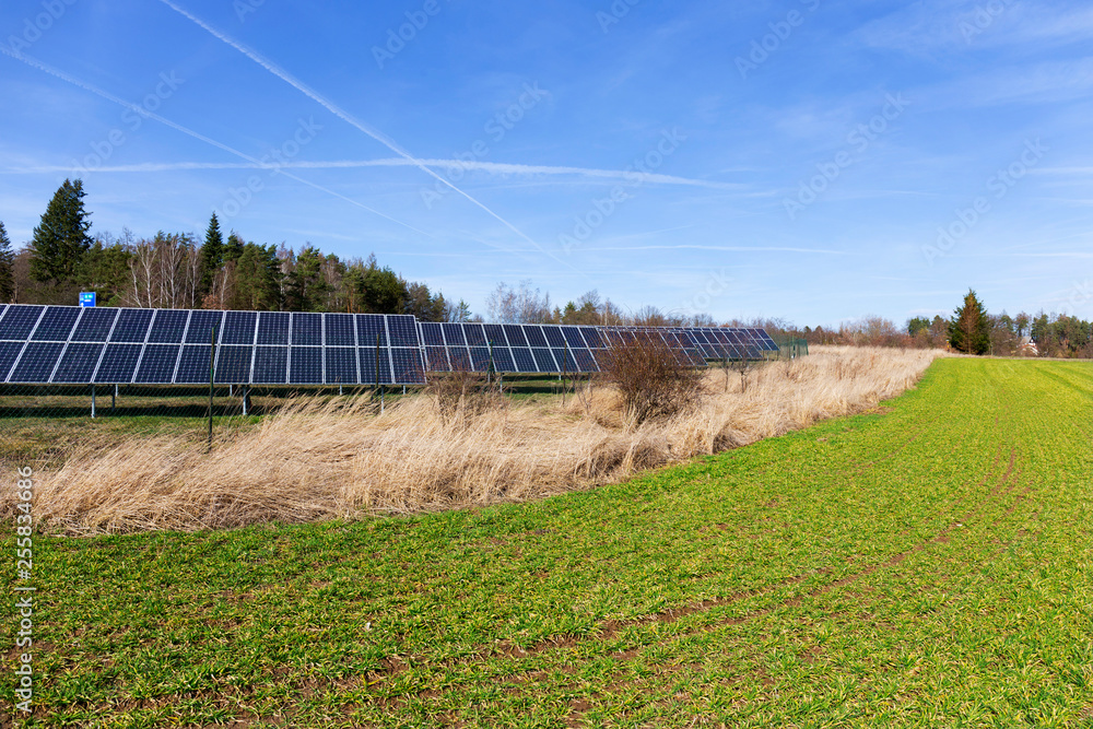 Solar Power Station on the early spring Meadow 
