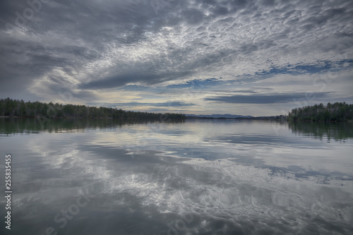  The Electric Lake  dramatic detailed cloud reflections in the still water of a large lake Zen Duder Lake James Collection