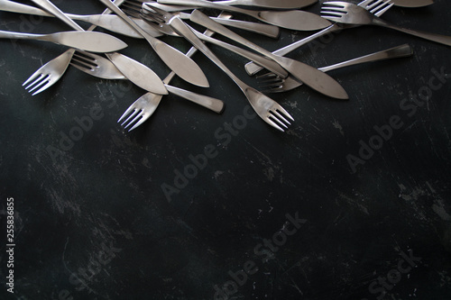 Cutlery on dark  wooden background menu photo