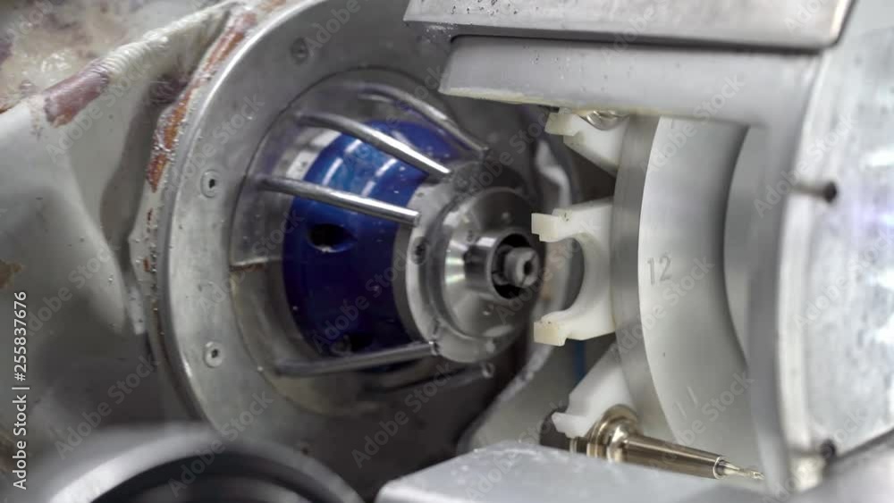 Closeup view at hi-speed spindle of dental milling machine which putting on drill Closeup view at hi-speed spindle of dental milling machine which putting on drill