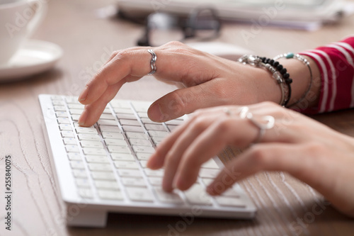 woman hands typing computer keyboard