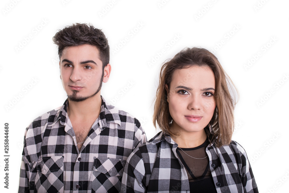 Girl and boy standing with shoulders close isolated Girl and boy standing with shoulders close isolated