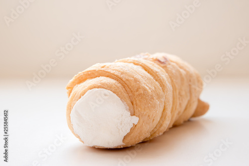 A kremrole or cream roll. A traditional pastry dessert tube filled with cream or meringue and served in central Europe, Czechia, Slovakia and Austria