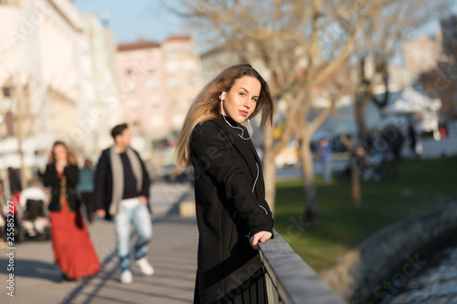 Beautiful girl listening to the music with earphones