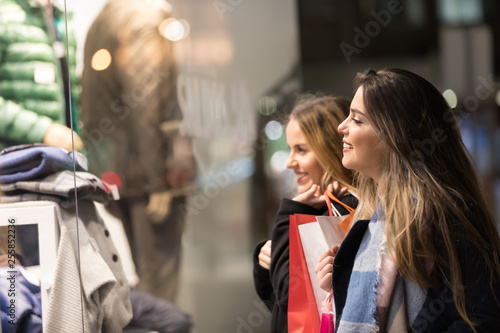 Happy young women with shopping