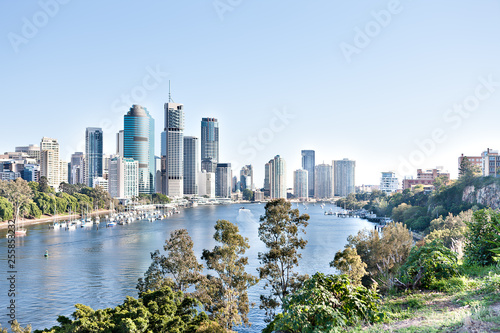 Brisbane City building with river around trees at sunny day © JRstock
