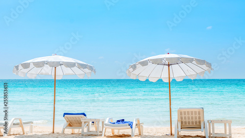 Summer vacation background. deckchairs on white sand beach and ocean sea. Travel and relax with holiday.