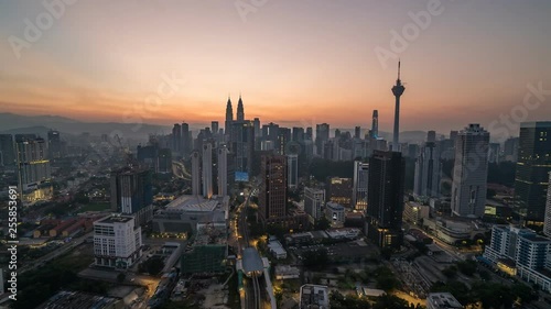 KUALA LUMPUR, MALAYSIA - MARCH 17, 2019: 4K Cinematic Sunrise Time Lapse Footage of Kuala Lumpur city skyline from the west side of the Malaysian capital.