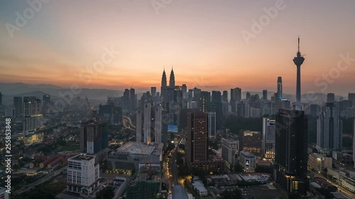 KUALA LUMPUR, MALAYSIA - MARCH 17, 2019: 4K Cinematic Sunrise Time Lapse Footage of Kuala Lumpur city skyline from the west side of the Malaysian capital.