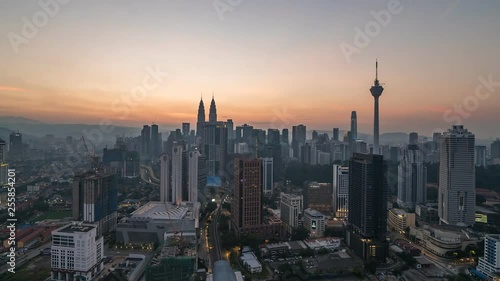 KUALA LUMPUR, MALAYSIA - MARCH 17, 2019: 4K Cinematic Sunrise Time Lapse Footage of Kuala Lumpur city skyline from the west side of the Malaysian capital.