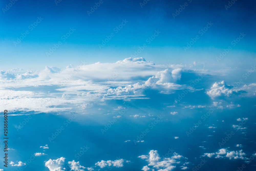Top view of white clouds above the ground or water Top view of white clouds above the ground or water