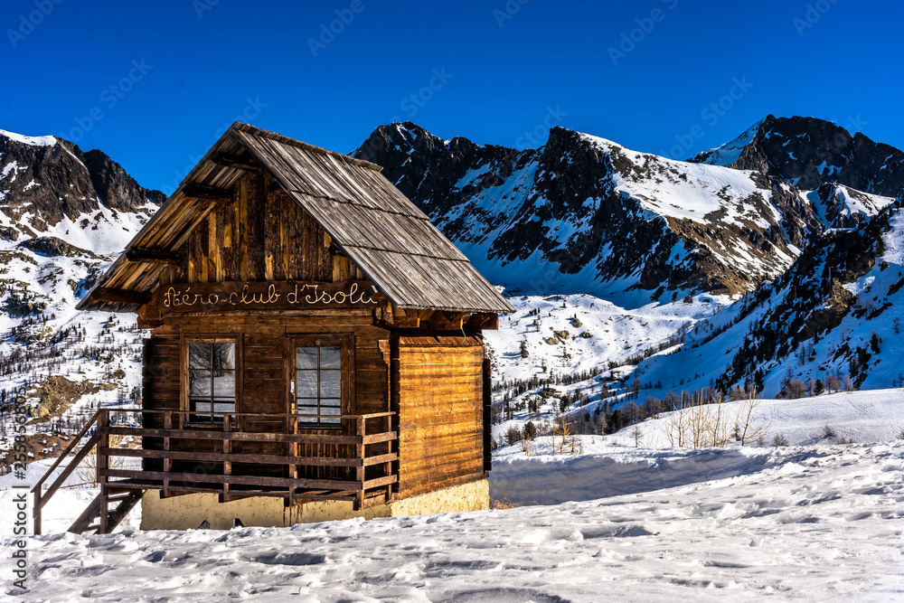 wooden hut in mountains in ski resort isola 2000, france