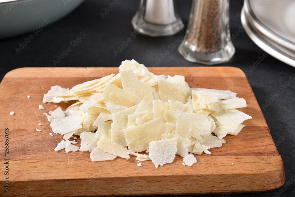 Shaved asiago, parmesan and romano cheeses Shaved asiago, parmesan and romano cheeses
