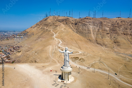 Aerial view of Cristo del Pacifico and Morro Solar hill in the background. Summer day, tourists visiting the monument that was a gift from Alan Garcia and Odebrecht. photo