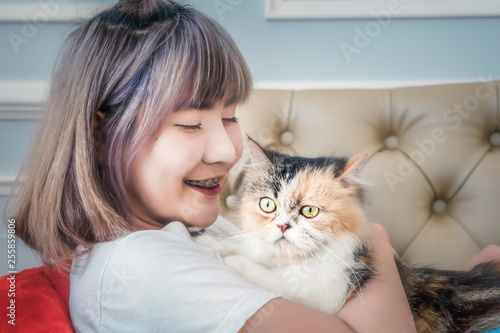 portrait of Asian female with cute cat
