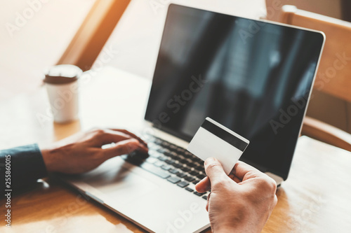 Online banking businessman using Laptop with credit card Shopping online Fintech and Blockchain concept photo