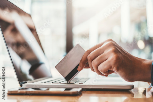 Online banking businessman using Laptop with credit card Shopping online Fintech and Blockchain concept photo
