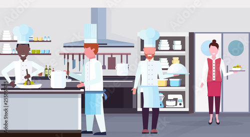 mix race chefs cooking food culinary staff teamwork concept modern commercial restaurant kitchen interior horizontal flat
