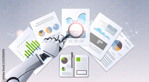 robot hand holding magnifying glass financial graphs report data analysis top angle view artificial intelligence digital futuristic technology concept flat horizontal