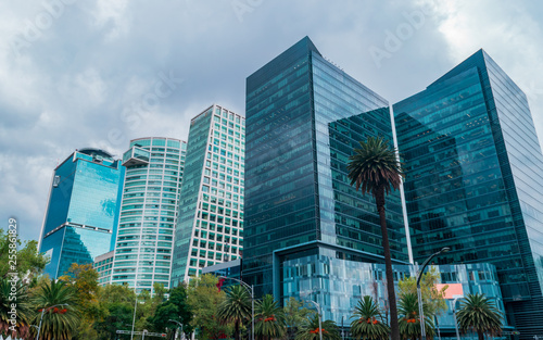 Fullshot  of five corporate modern buildings in the famous street of "Reforma" on blue sky