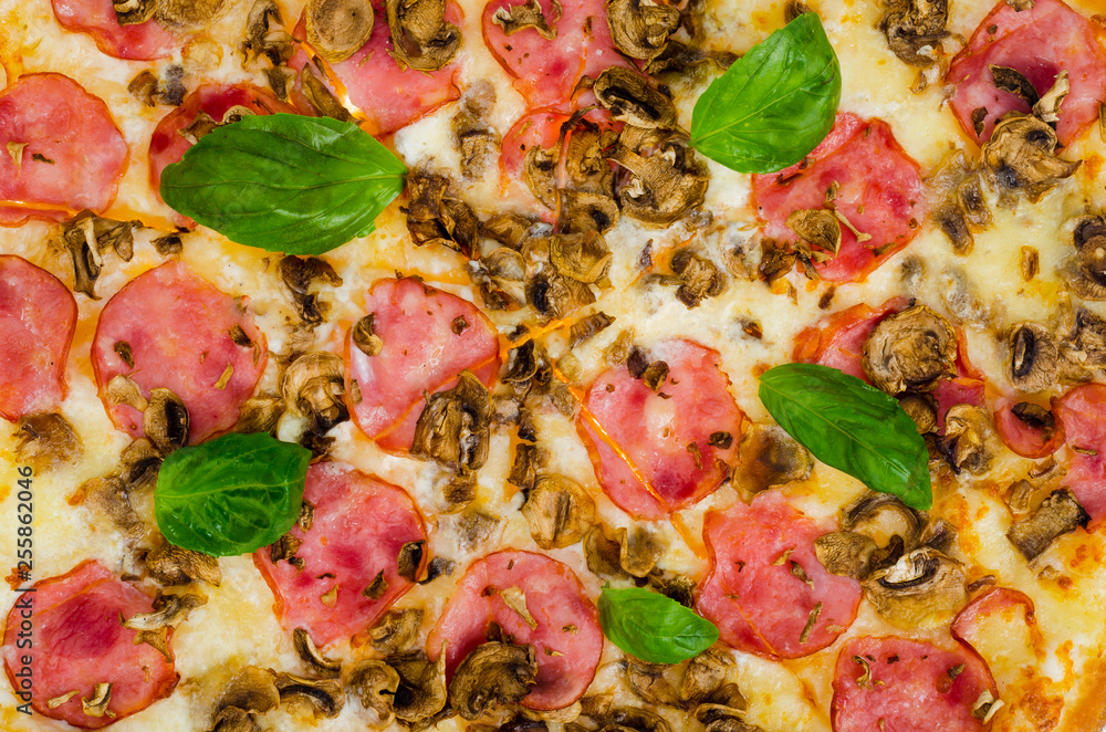 Background, texture of pizza with ham and mushrooms.