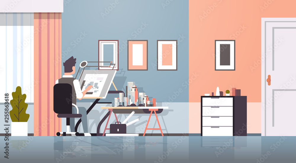 architect drawing blueprint urban building plan on adjustable board panning project concept engineer sitting workplace office draftsman studio interior horizontal full length
