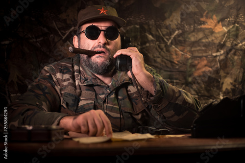 Cuadro en lienzo The evil dictator sitting on table