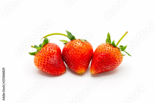 Fototapeta Naklejka Na Ścianę i Meble -  Fresh Three Strawberry Isolated on White Background.