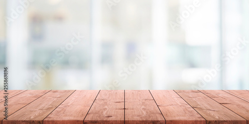 Empty wood table top and blurred abstract restaurant interior background - can used for display or montage your products.