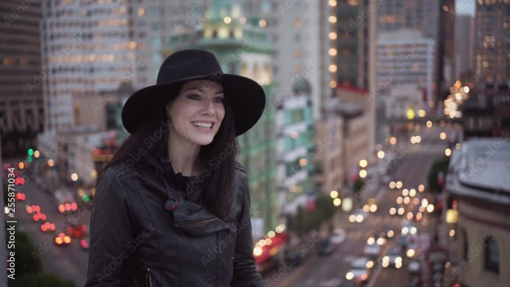 Happy Girl Emotionally Talking On The Roof Of A Building. Happy Girl Emotionally Talking On The Roof Of A Building.