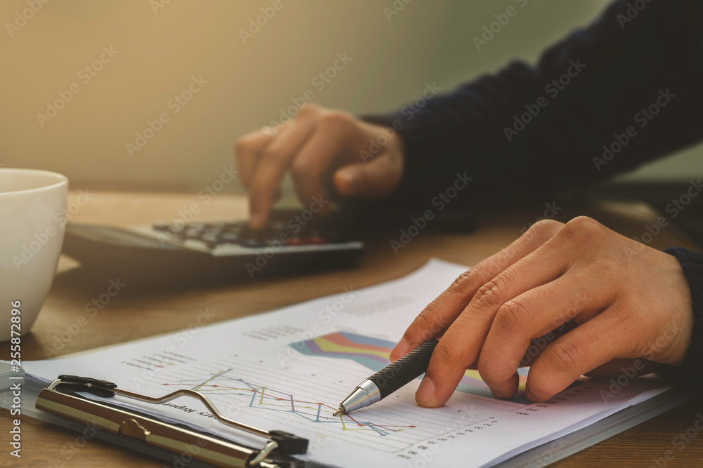 Business man accounting calculating cost Business man accounting calculating cost