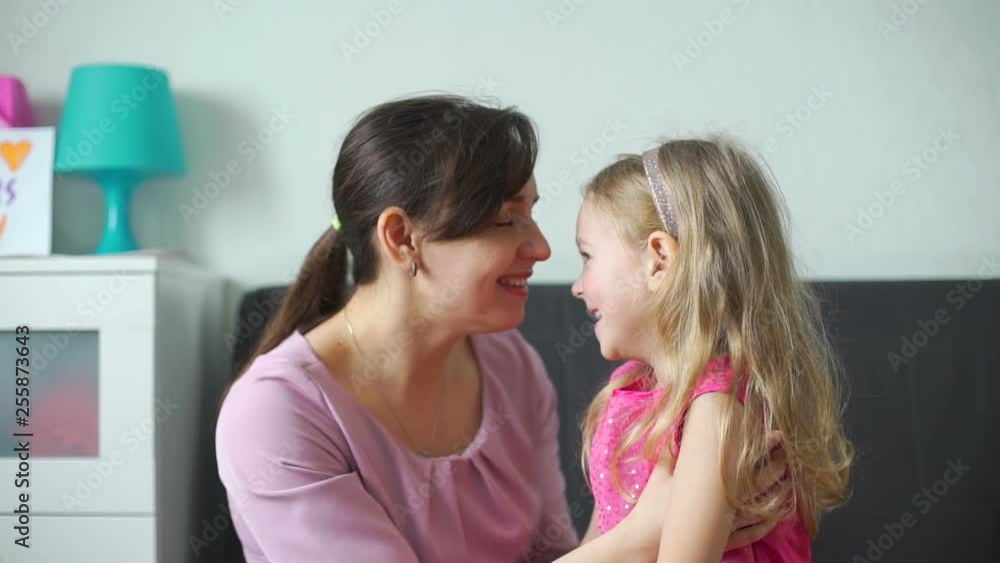 Young Woman and her Daughter Having Fun Together Young Woman and her Daughter Having Fun Together